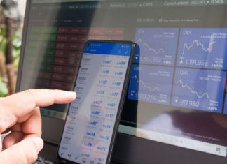 Should You Get a Backup Broadband Line for Your Business? managing-stocks-phone-and-computer-screen
