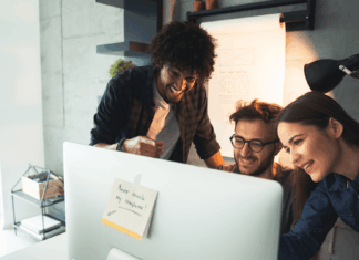 Budget-Friendly VoIP Setups For London Startups startup-employees-around-computer-screen-smiling