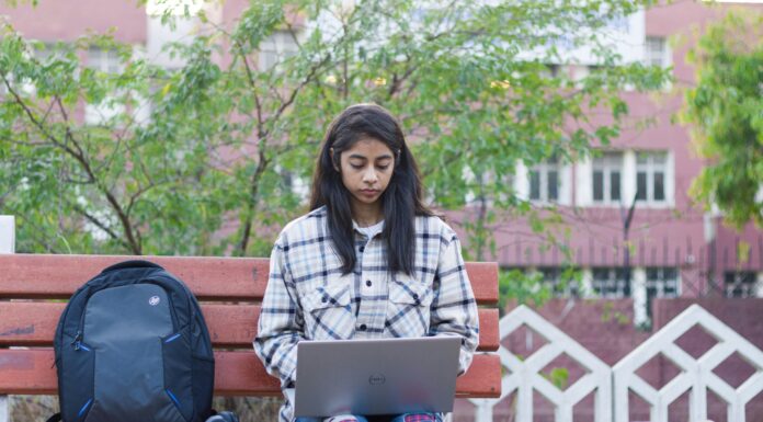 Can I Get Student Discounts on Broadband? student-working-outdoors-on-park-bench