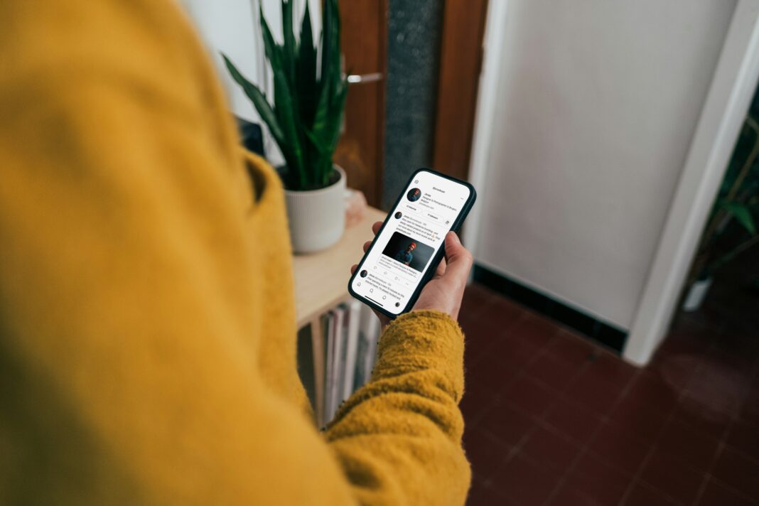 How to Share a Home Connection Without Slowing Work Apps looking-at-phone-screen-at-home