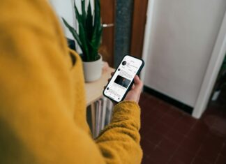 How to Share a Home Connection Without Slowing Work Apps looking-at-phone-screen-at-home