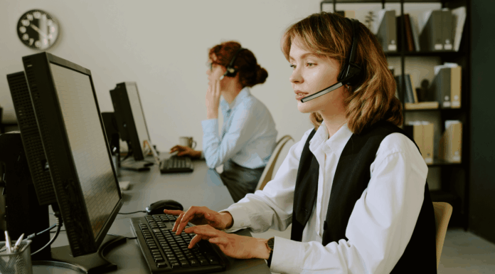 Experts Share: Cross-Border Challenges Of VoIP Compliance two-girls-working-in-office-with-headsets