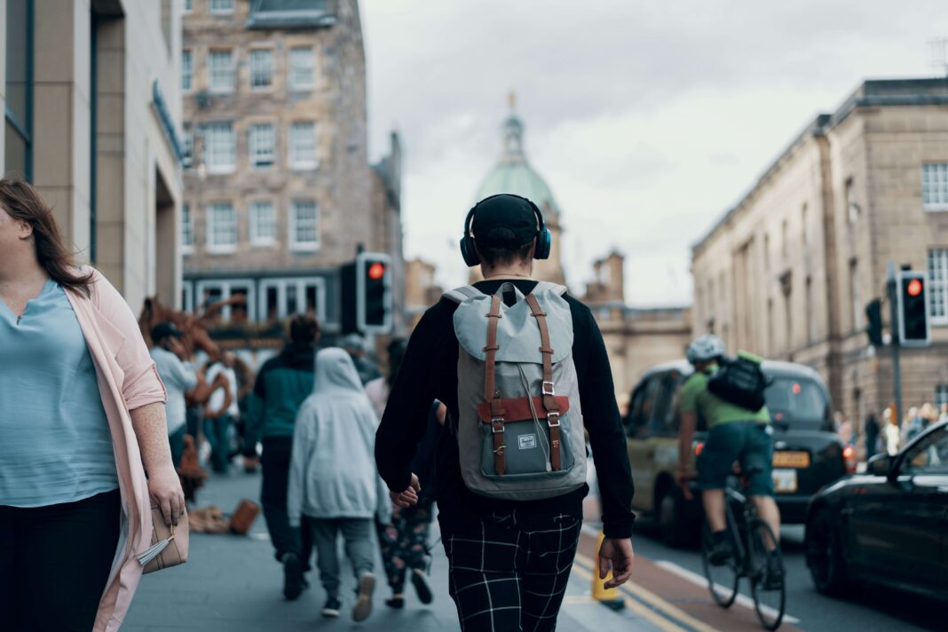 walking-through-europe-with-phone-headset-casual