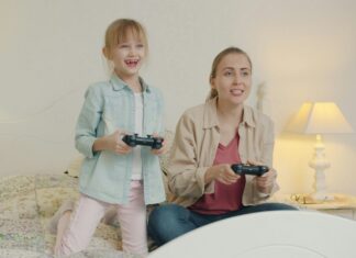 How to Child-Proof Your Home WiFi Network little girl and mum playing video games