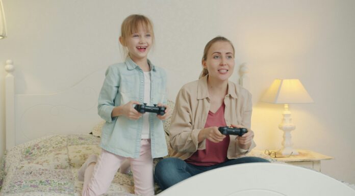 How to Child-Proof Your Home WiFi Network little girl and mum playing video games