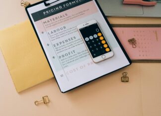 The Economics of VoIP desk-with-clipboard-pricing-formula-and-phone-calculator