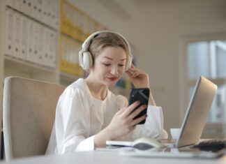 How Quantum Encryption Could Transform VoIP Security girl-sitting-at-desk-headphones-looking-at-phone