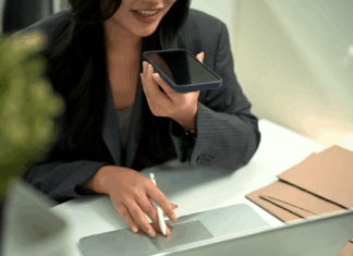 How Is VoIP Making Voice-Activated Business Automation A Reality? professional-woman-working-woman-phone-call-using-laptop