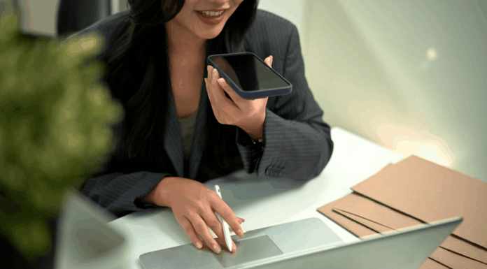 How Is VoIP Making Voice-Activated Business Automation A Reality? professional-woman-working-woman-phone-call-using-laptop