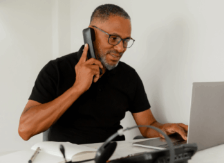 The VoIP Verdict: bOnline vs RingCentral man-talking-on-voip-phone-using-laptop