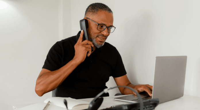The VoIP Verdict: bOnline vs RingCentral man-talking-on-voip-phone-using-laptop